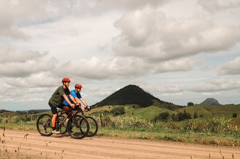 Noosa gravel riders on a gravel road in the Noosa Hinterland on the Noosa Trail network